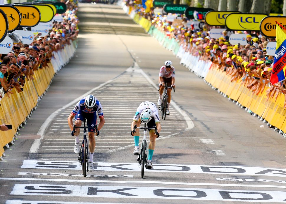 two cyclists come to line in photofinish