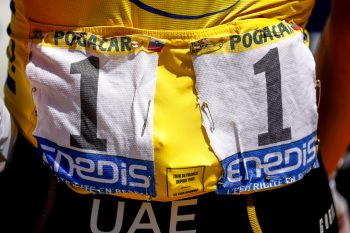 Numbers pinned to yellow jersey messily